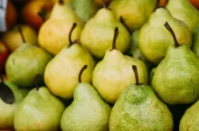 Green Ripe Pears At A Farmers Market. Heap Of Fruits.
