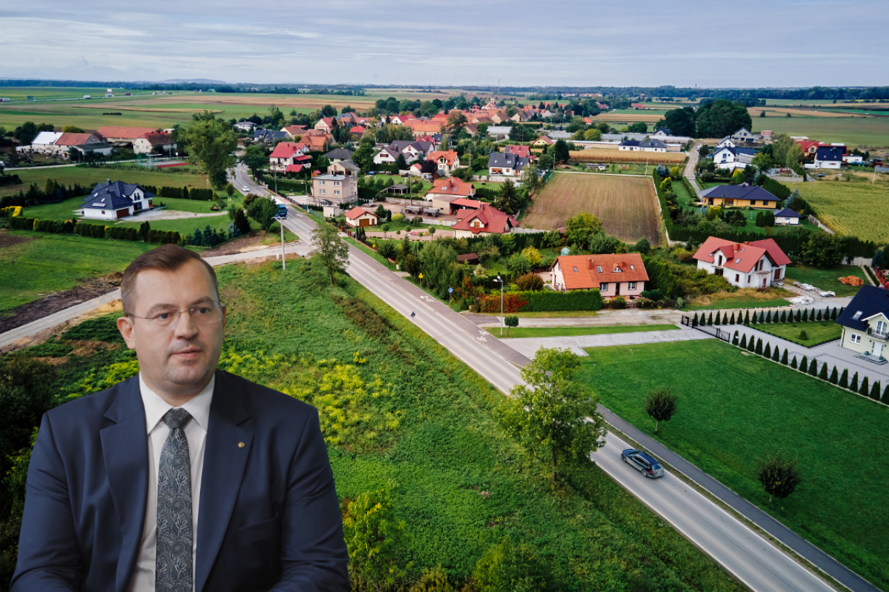 Minister rolnictwa Stefan Krajewski na tle wsi